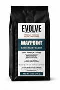 A 12 oz black bag of Evolve Bean Coffee Company's Waypoint Dark Roast Blend coffee, shown against a plain white background.