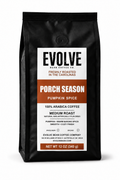 A 12 oz black bag of Evolve Bean Coffee Co. 'Porch Season' pumpkin spice coffee, featuring a white and orange label on a clean white background.